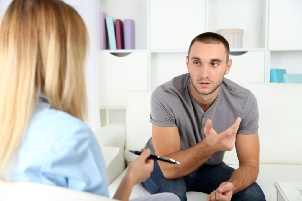 Patient explaining his situation to his therapist
